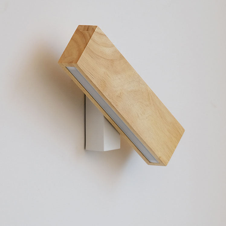 Wooden lamp bar tilted at an angle on a white mount, unlit, showing the frosted diffuser along its edge. 13