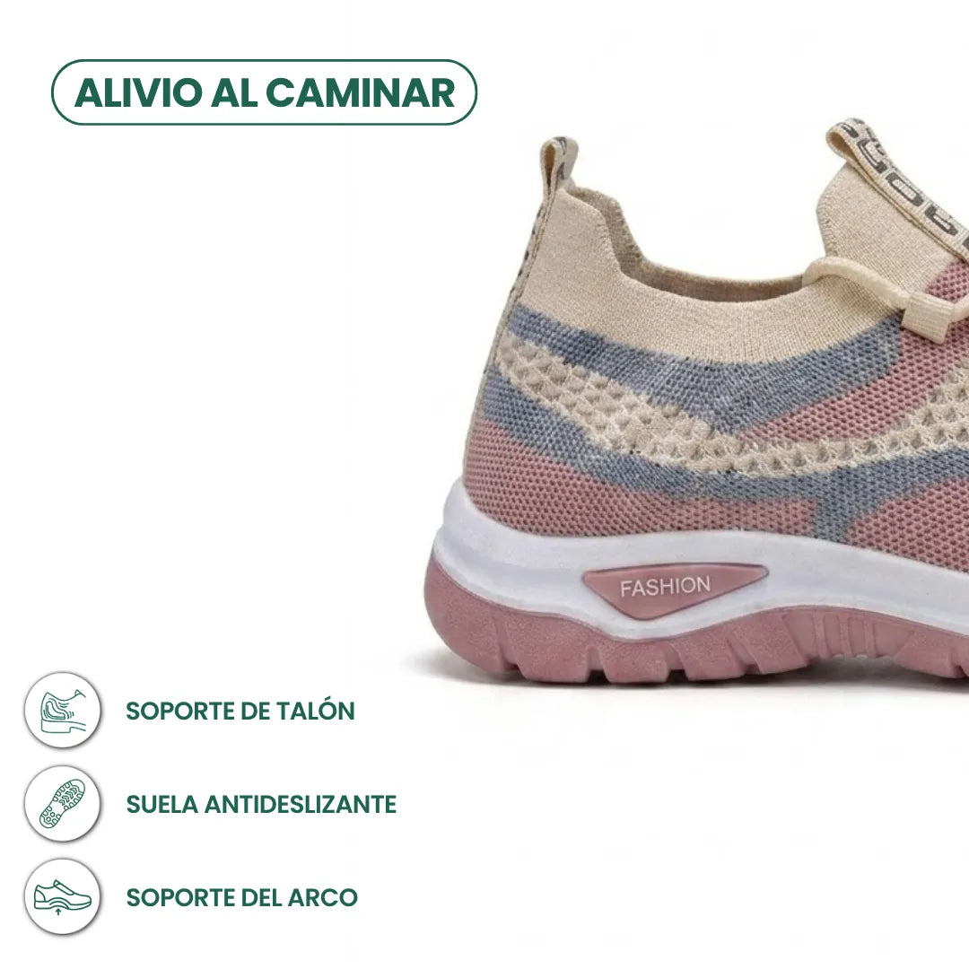 Tył beżowego sneakersa z różowo-niebieską siateczką i różową podeszwą, z opisem wsparcia pięty, antypoślizgowej podeszwy i podparcia łuku. 31