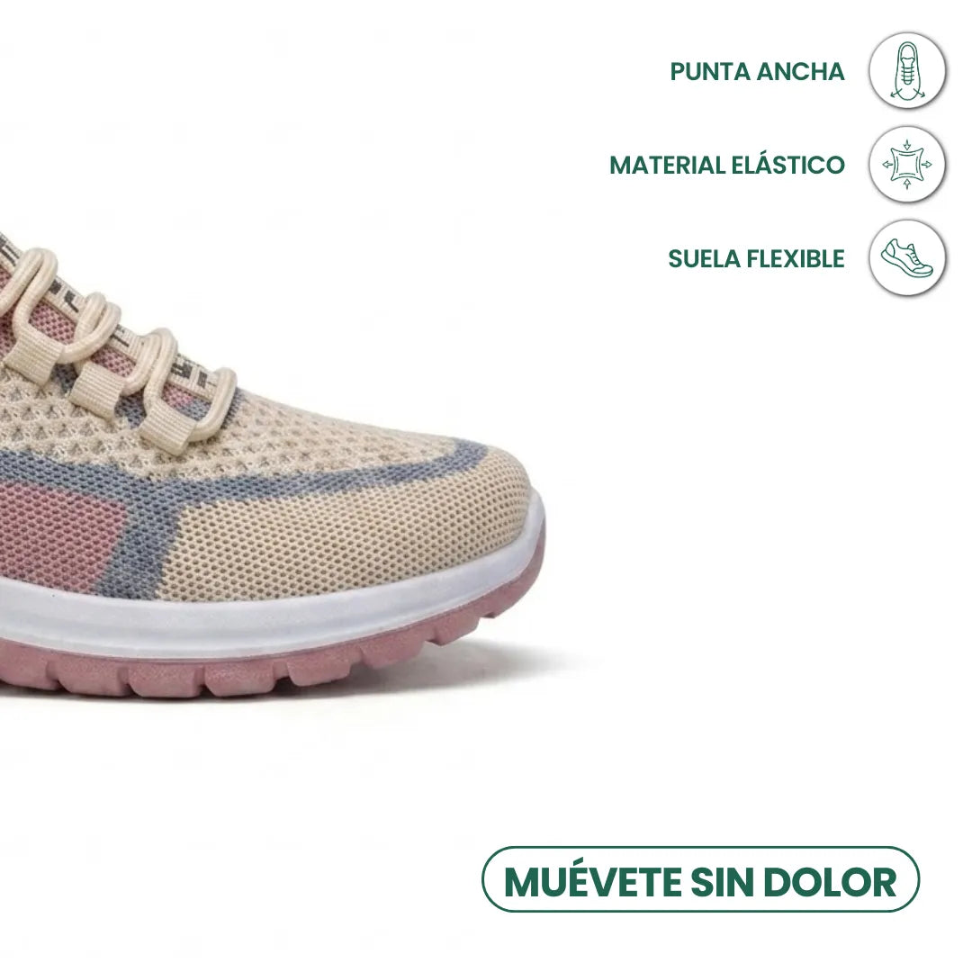 Przód beżowego sneakersa z różowymi i niebieskimi wstawkami, szeroki nosek, obok ikony szerokiej, elastycznej i giętkiej konstrukcji. 32