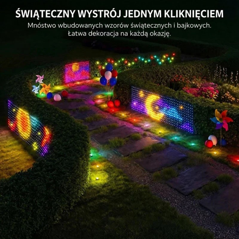 Ogrodowa ścieżka nocą z kolorowymi panelami świetlnymi w żywopłocie, wiatraczkami i balonami 7