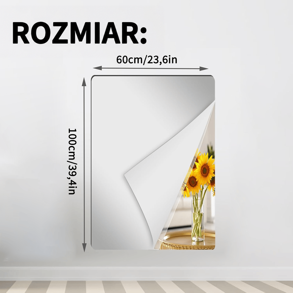 Prostokątny arkusz lustrzanej folii z odgiętym rogiem na ścianie, z wymiarami 60 na 100 cm 14