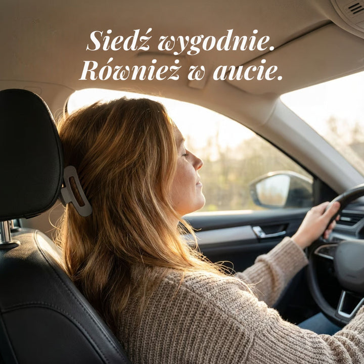 Kobieta za kierownicą w samochodzie, szara spinka we włosach opiera się o zagłówek fotela 2