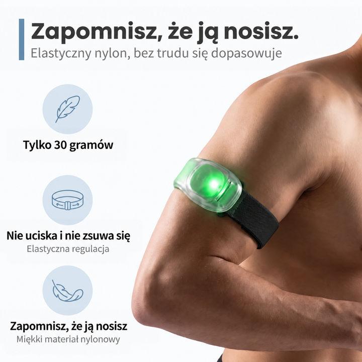 Zbliżenie na ramię mężczyzny z opaską z zielonym światłem na elastycznym czarnym pasku 4