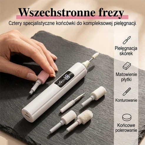 Dłoń wymienia różową końcówkę w białej frezarce leżącej na łupku, wokół ułożone pozostałe końcówki 3