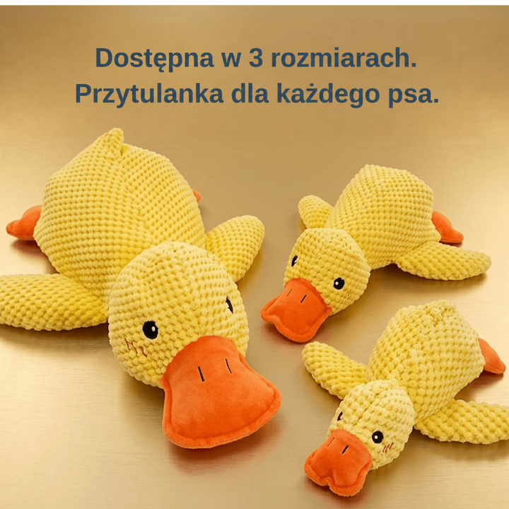 Trzy żółte pluszowe kaczki w różnych rozmiarach leżą obok siebie na złotym tle 4