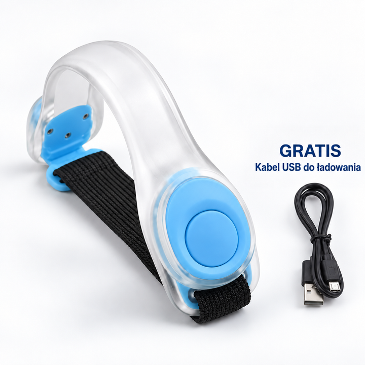 Przezroczysta opaska z niebieskimi elementami i czarnym paskiem, obok kabel USB 10