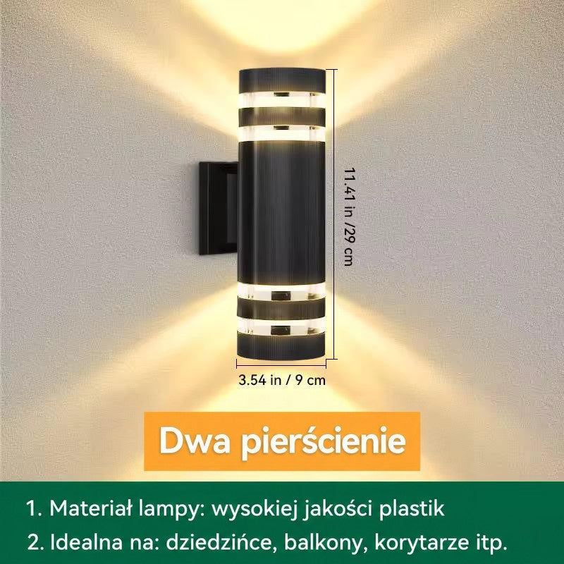 Grafika z wymiarami walcowego kinkietu z podwójnymi pierścieniami świetlnymi, wysokość około 29 cm 14