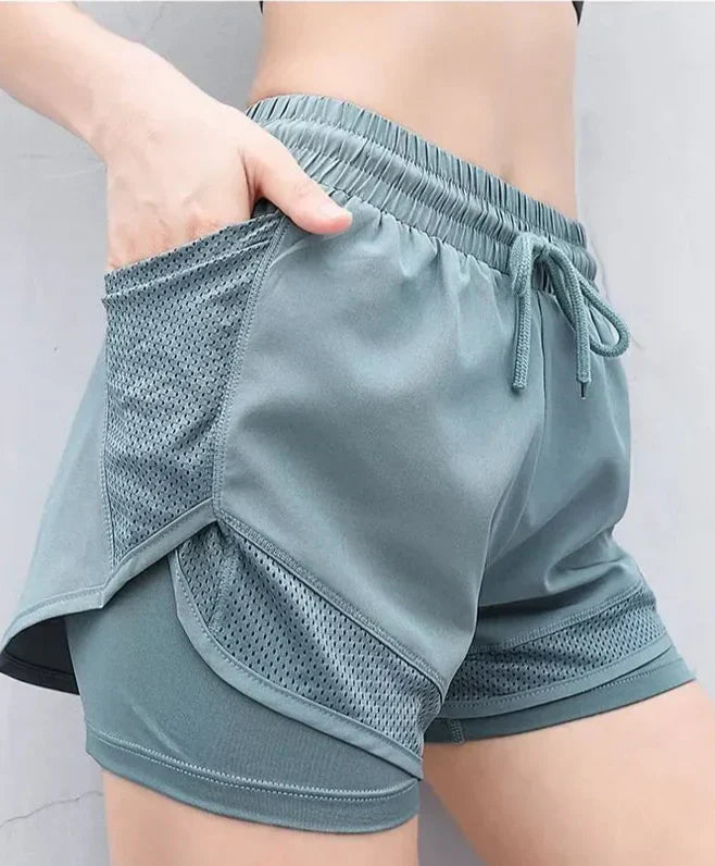 Oddychające i szybko schnące damskie wysokie szorty fitness – Mira-Jasnozielony-S-Trend Polska