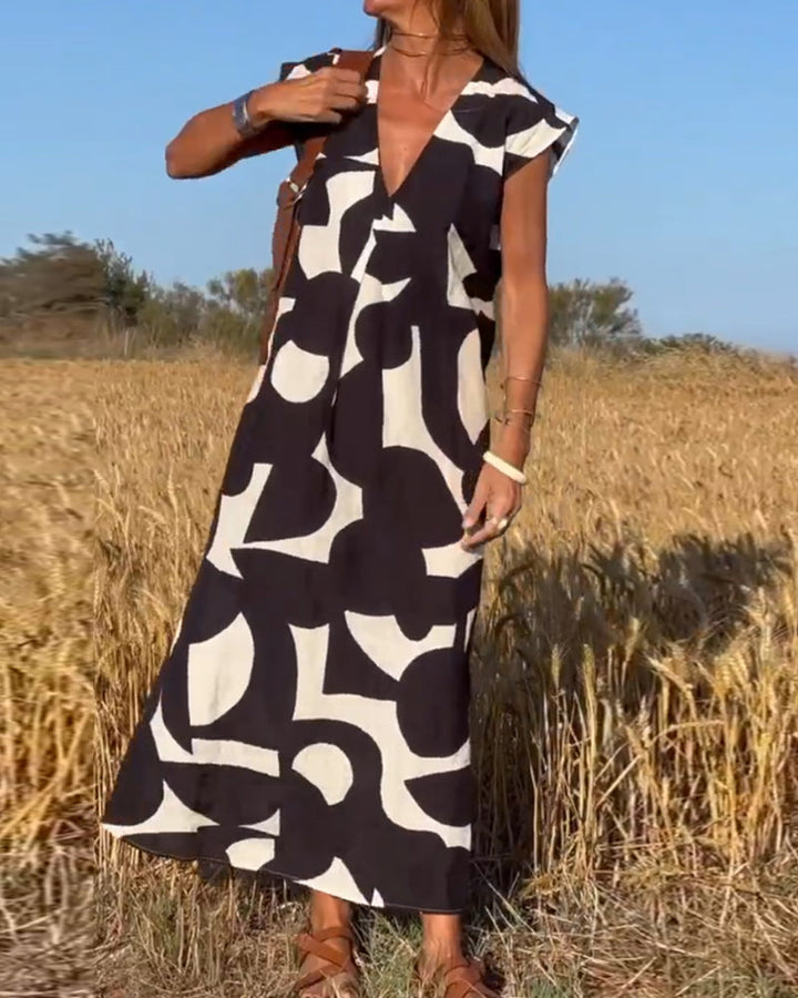 Sukienka maxi z dekoltem V i nadrukiem - Bella-Czarny-S-Trend Polska
